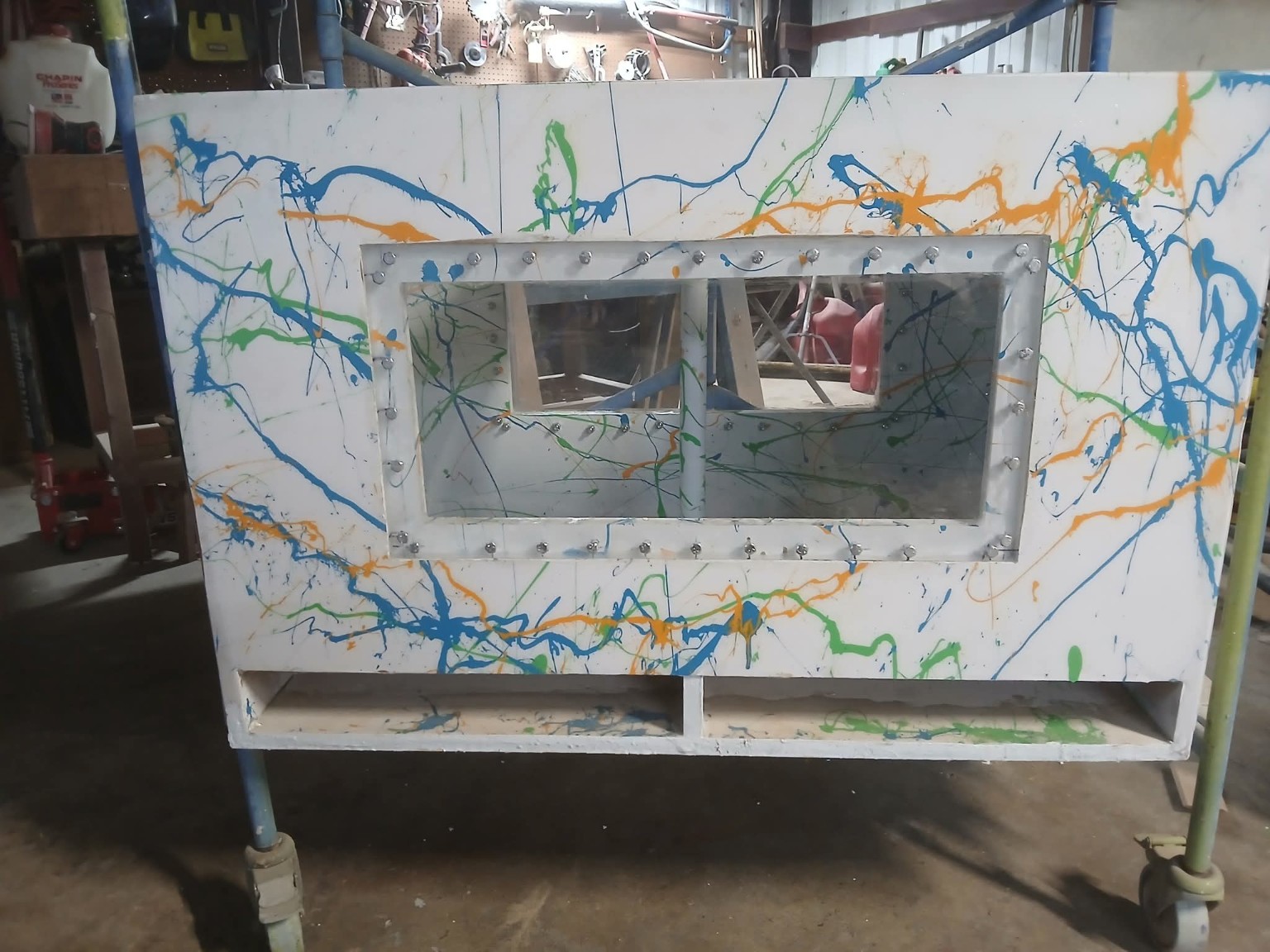White multicolor splatter enclosure with a large clear window and twin bottom ports