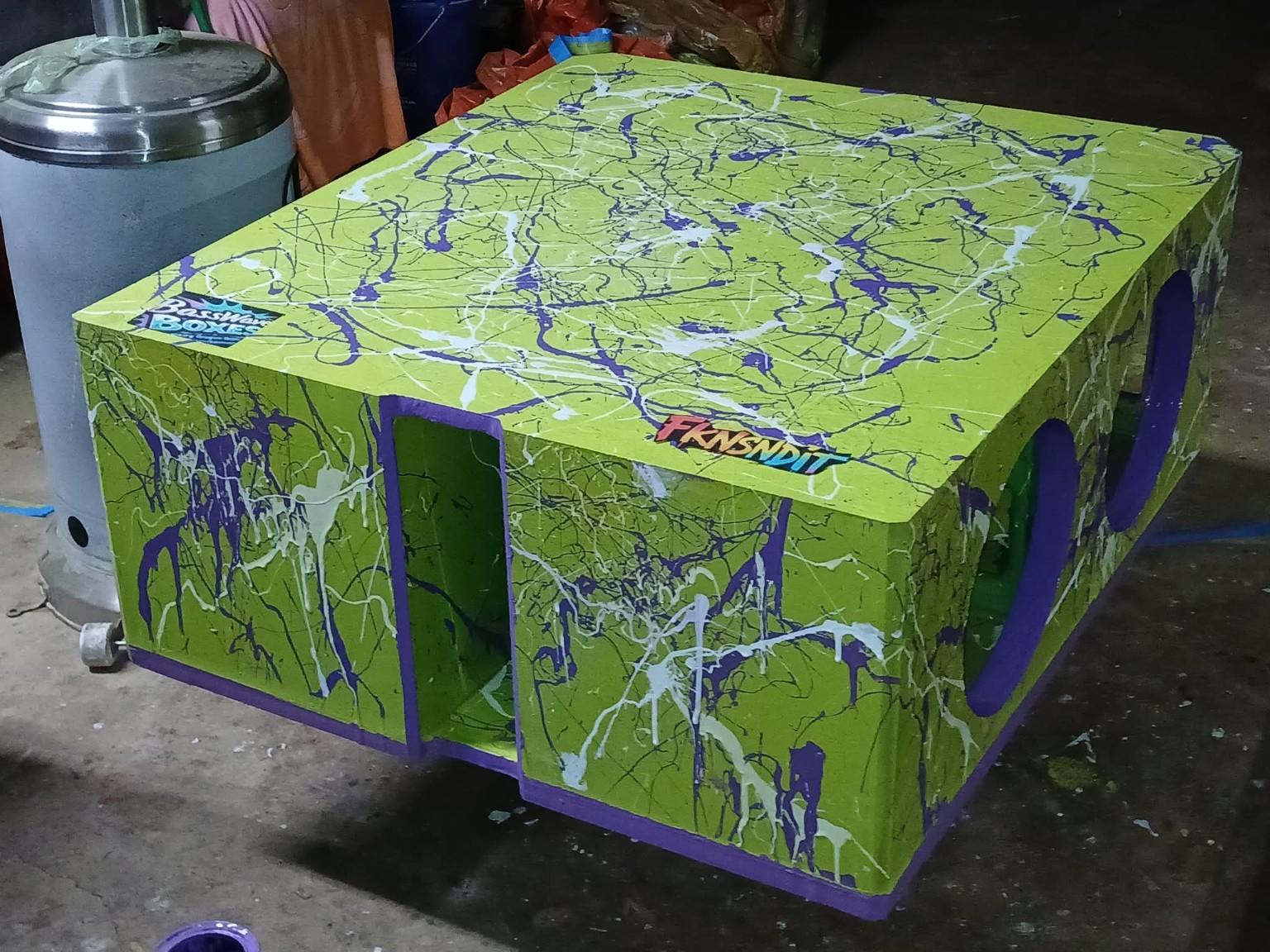 Lime green enclosure with purple and white splatter and a slot port