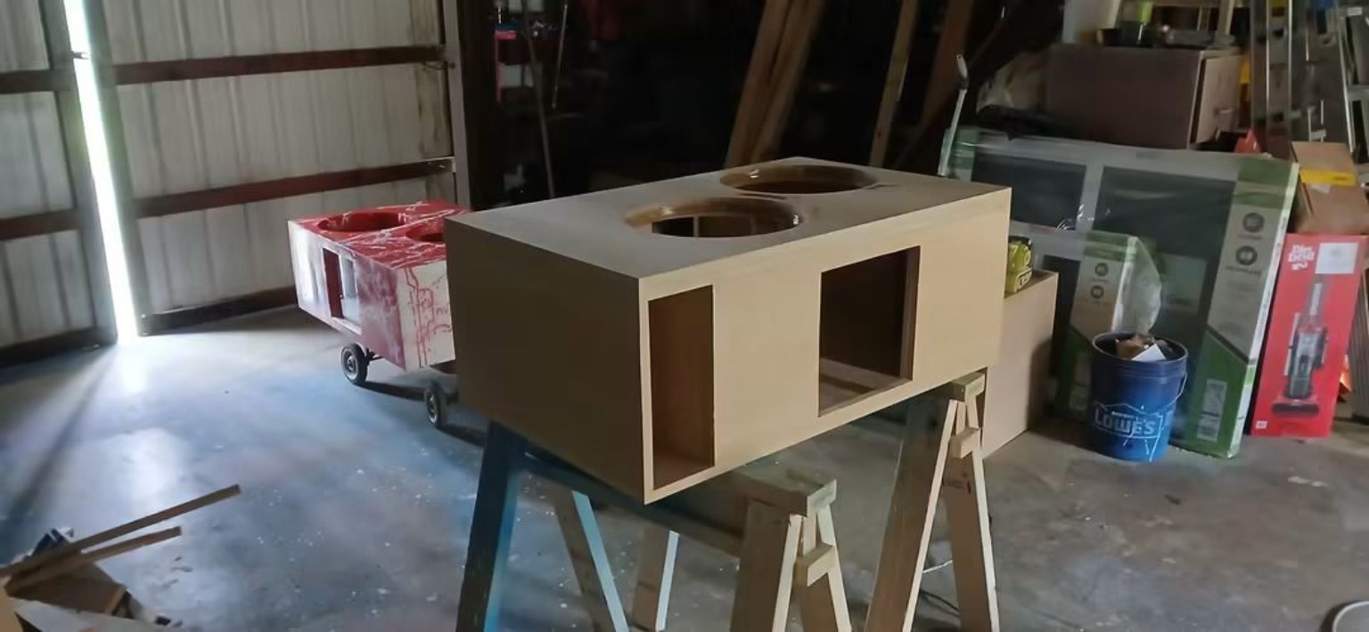 Unfinished dual-sub enclosure with a side port and window opening